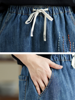 Playful Embroidered A-Line Denim Skirt with Drawstring Waist, Chic Midi