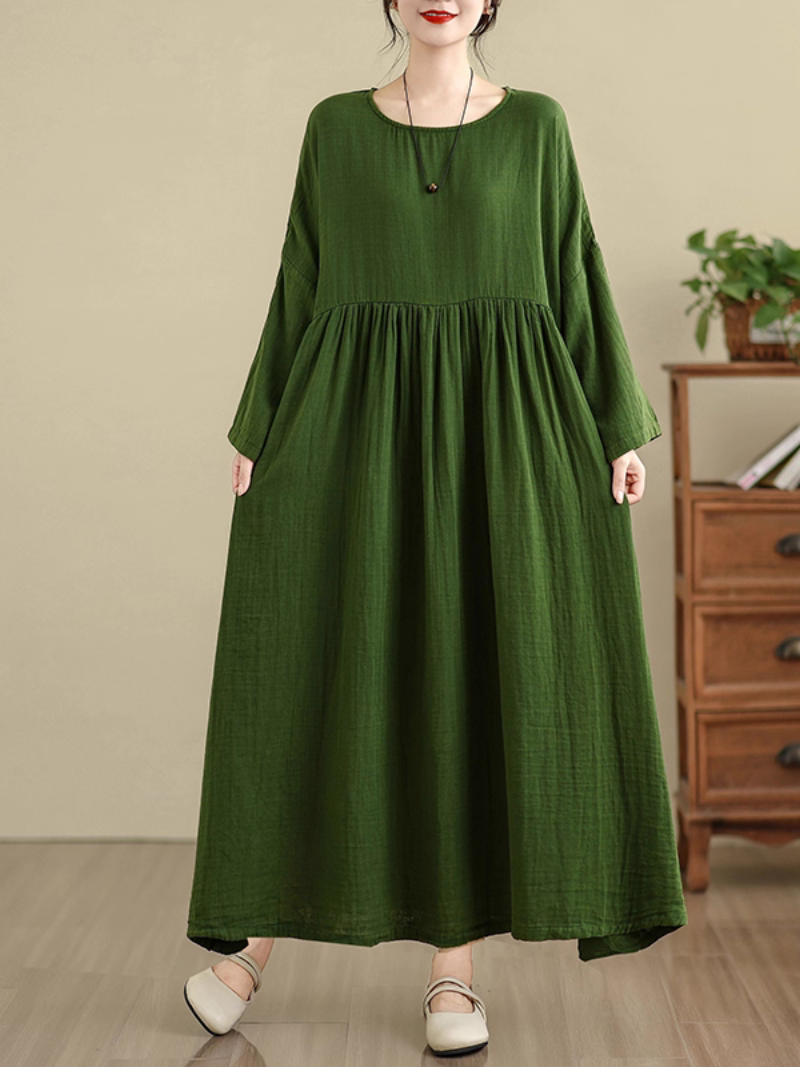 Woman wearing a green  Smock dress