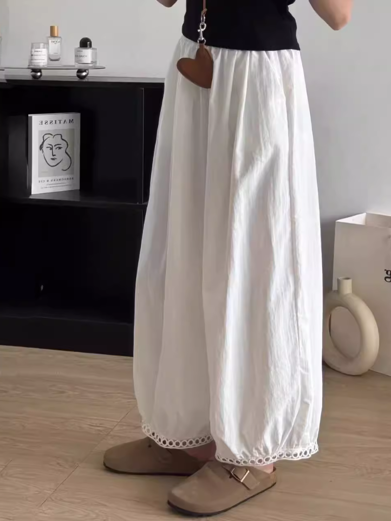   Women's wearing white wide-leg pants 