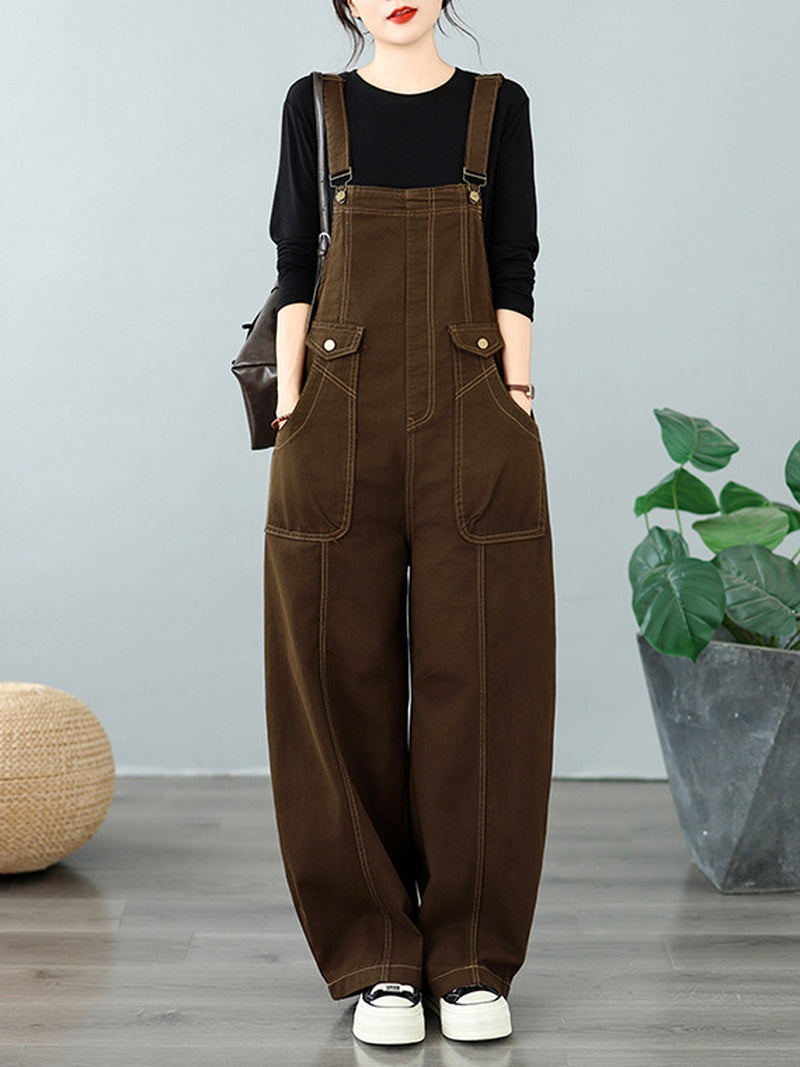A model wearing brown wide-leg overall pants 

